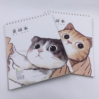 Skitseblokke med katte på forsiden